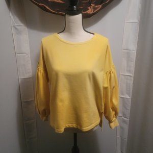 a.n.a. brand medium size yellow top, with long bishop sleeves.